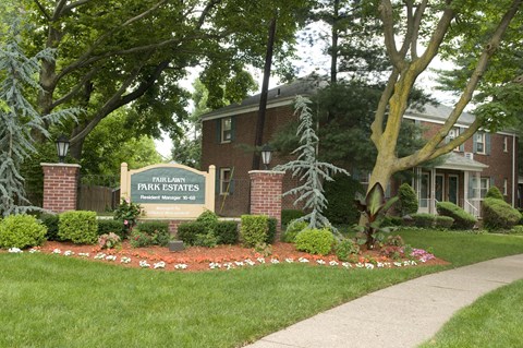 A sign that says Fairway Park Estates in front of a building.