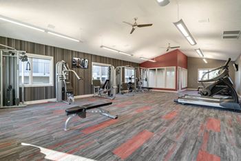 Large fitness center with cardio and strength equipment at Highland View
