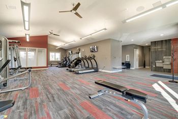 Large fitness center with cardio and strength equipment at Highland View