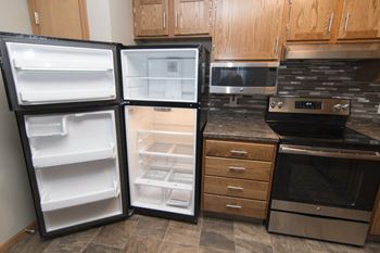 Open empty fridge and freezer at Highland View