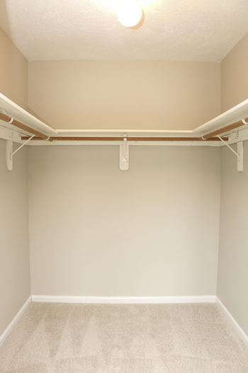 large walk in closet with light, shelving space, and hanging space at Eagle Run Apartments in Northwest Omaha, Nebraska