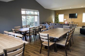 Dining tables and chairs at the clubhouse at Southwind Villas