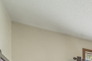 Interiors-Living room with ceiling fan in 2-bedroom apartment