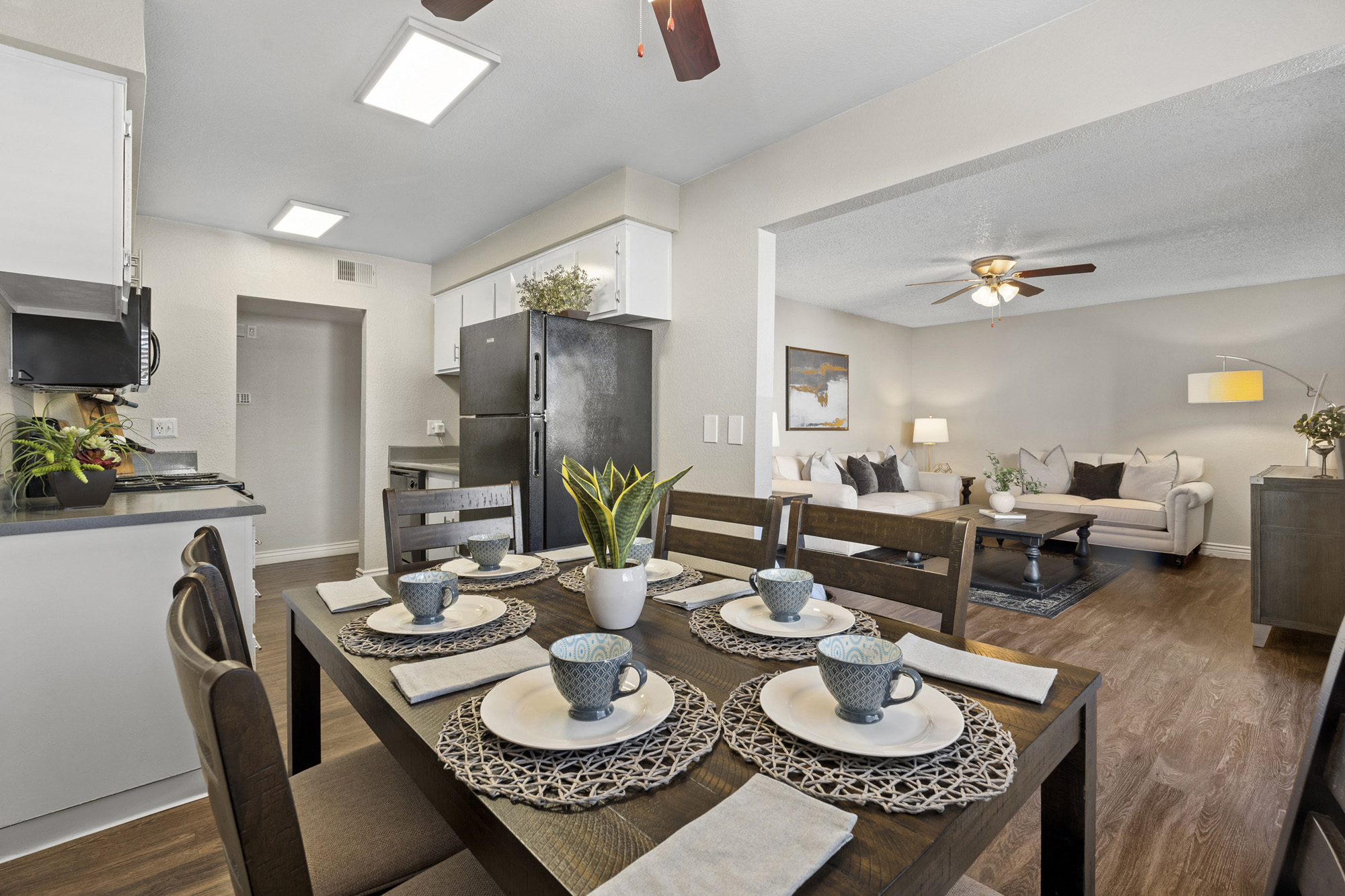 an open living room and dining room with a table and chairs
