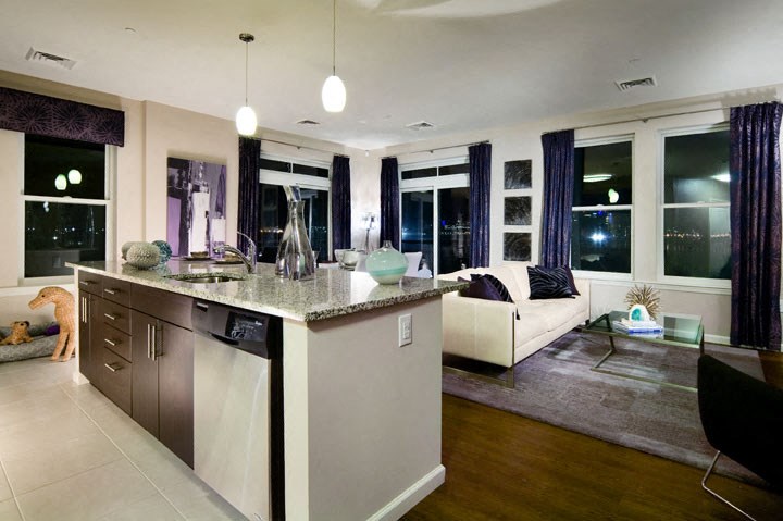 a kitchen with a view of a living room
