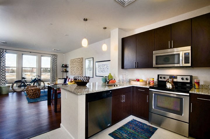 a kitchen with stainless steel appliances and a counter top