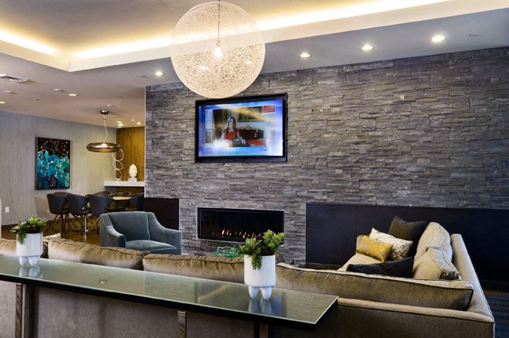 a living room with a couch and a fireplace