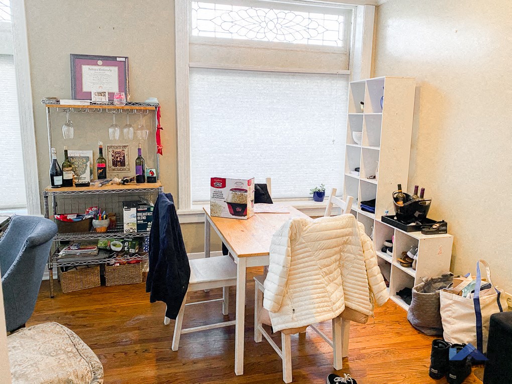 a room with a desk and a chair and a window