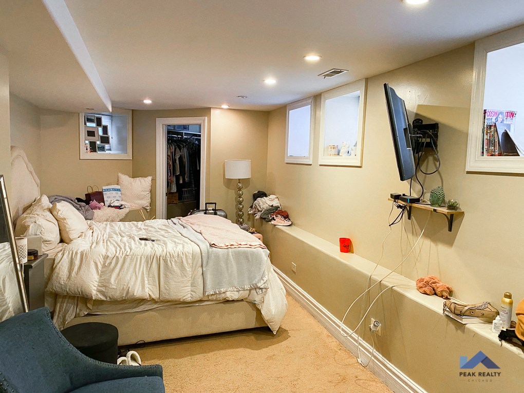 a bedroom with a bed and a tv