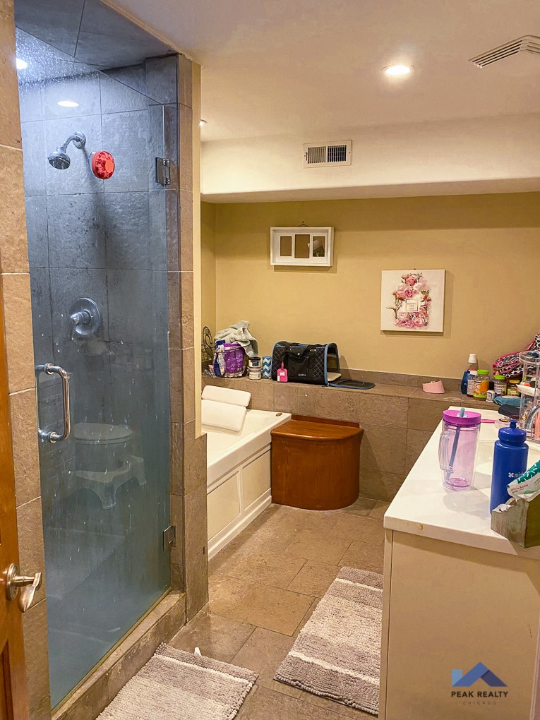 a bathroom with a shower and a sink