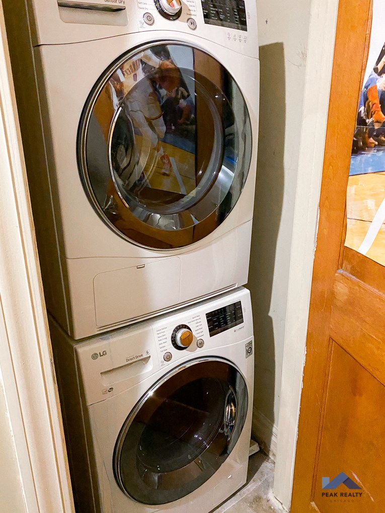 a washing machine and a dryer in a laundry room
