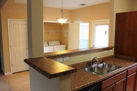 a kitchen with a sink and a counter top