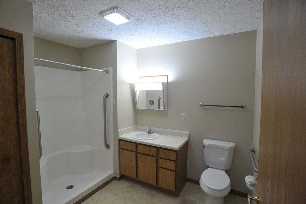 a small bathroom with a toilet sink and shower
