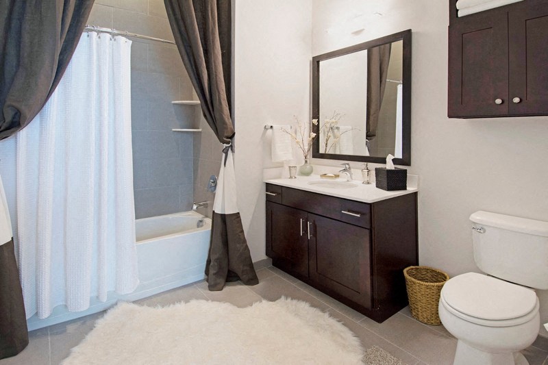 a bathroom with a sink toilet and a shower