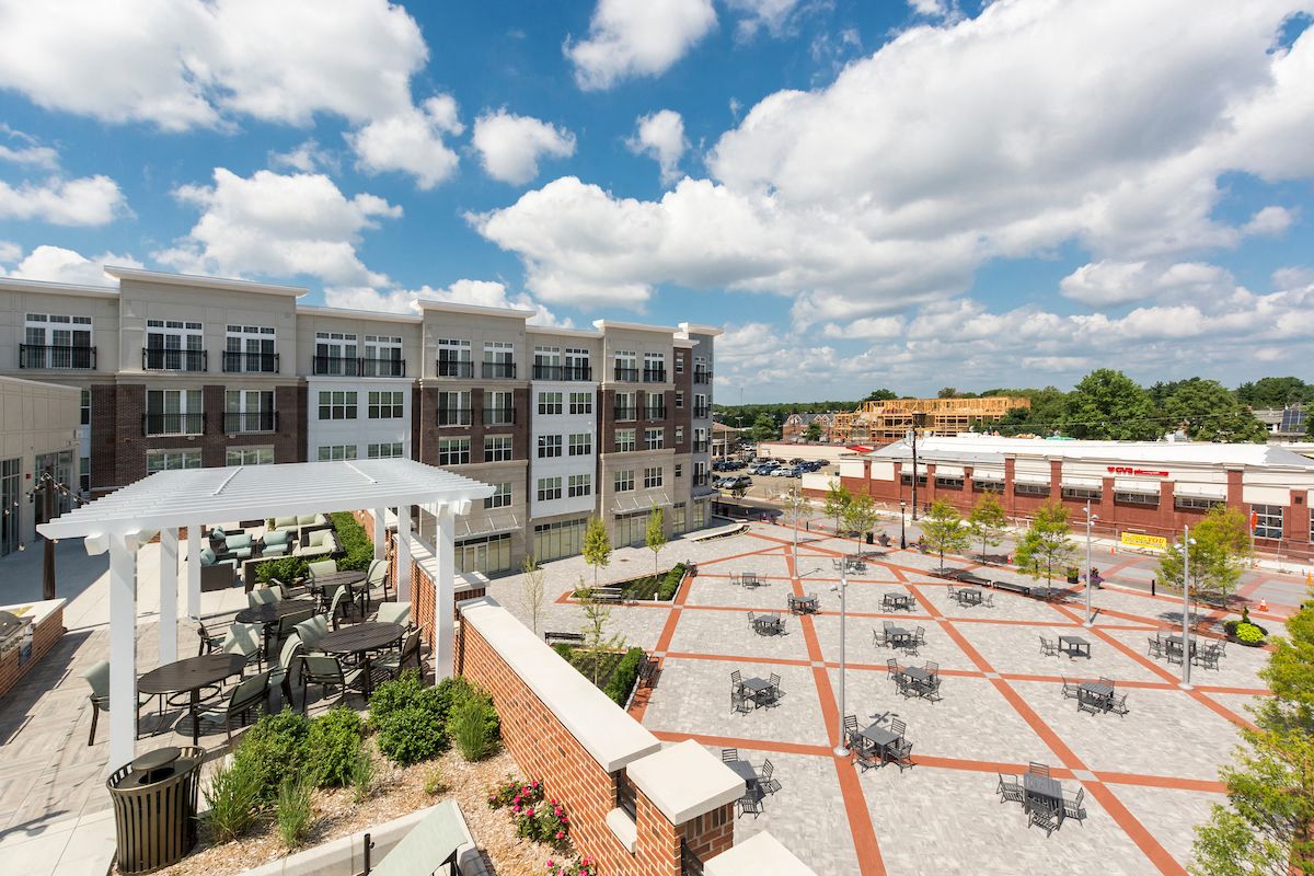 an aerial view of the courtyard of a new apartment building