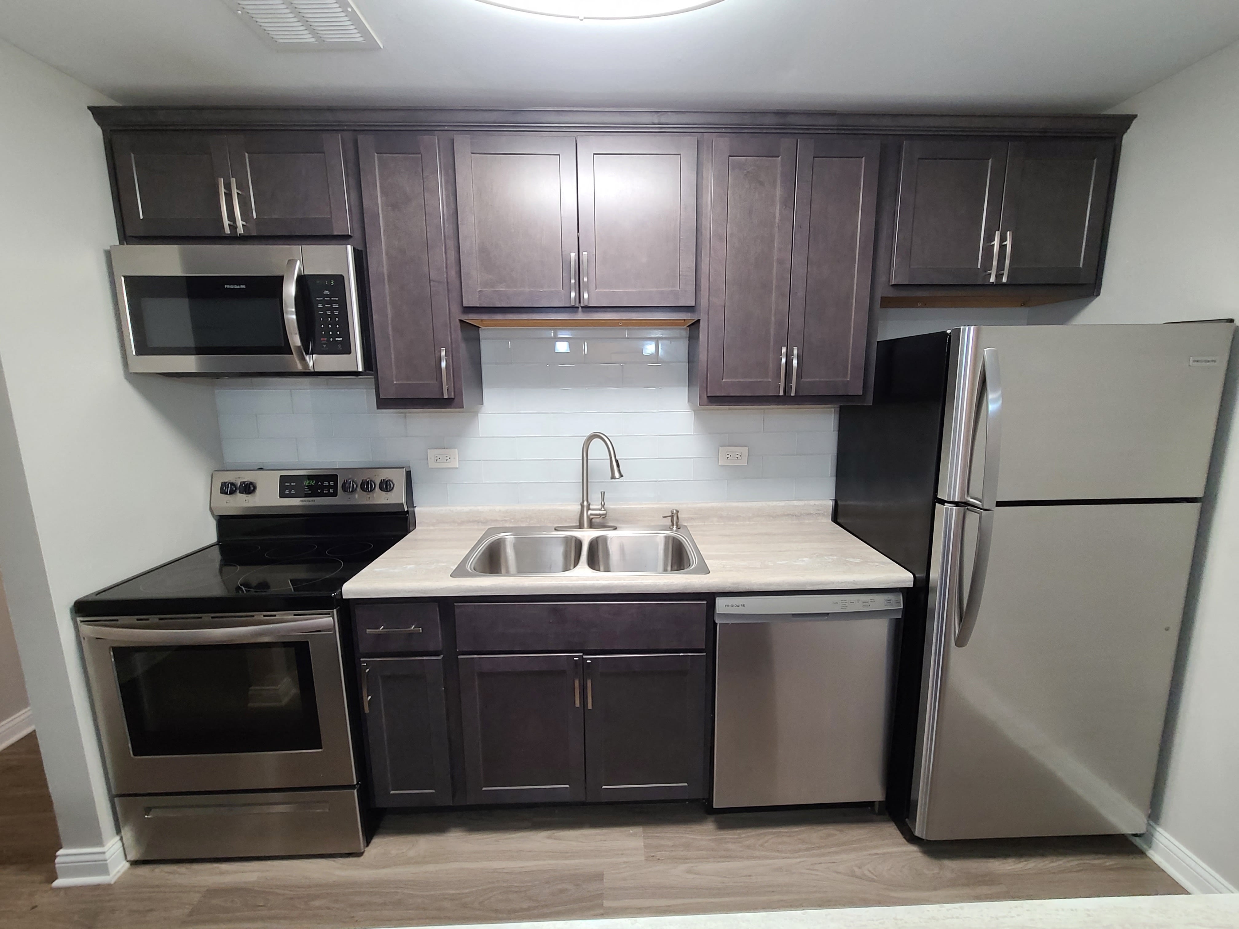 backsplash and stainless steel appliances