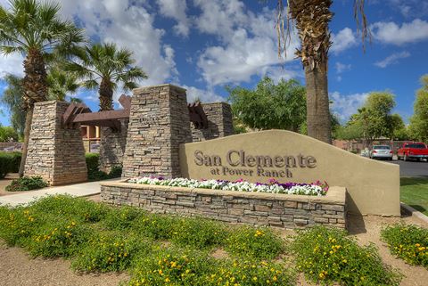 a sign for san clemente at power ranch with palm trees