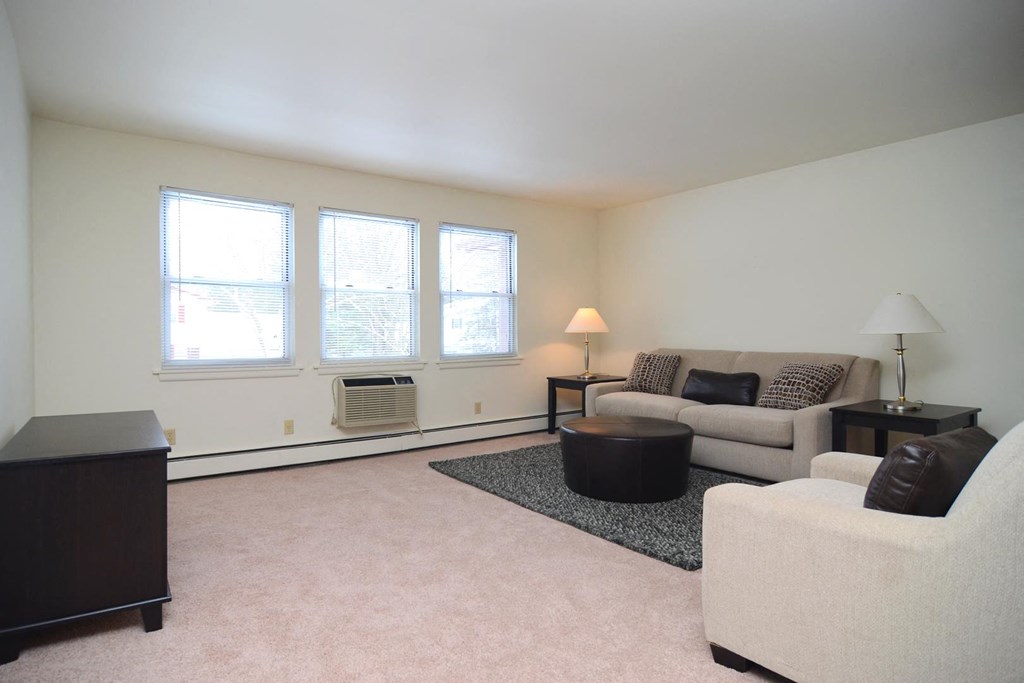 a living room with couches and a table