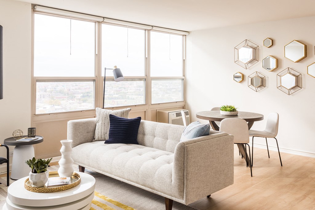 a living room with a couch and a round table