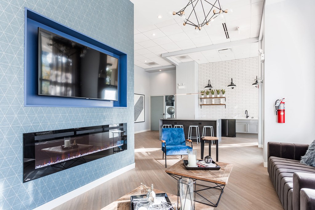 a living room with a fireplace and a television