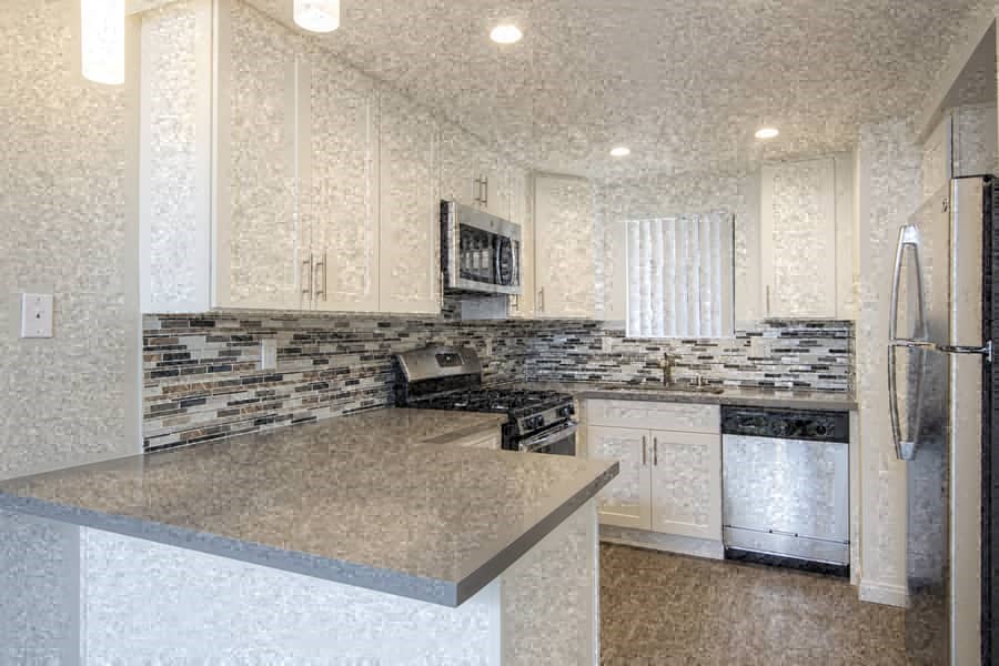 a kitchen with a counter top and a refrigerator