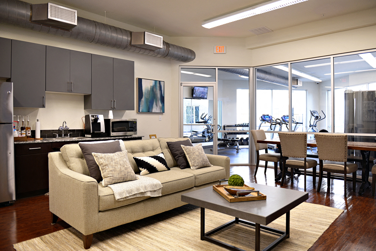 a living room with a couch and a table