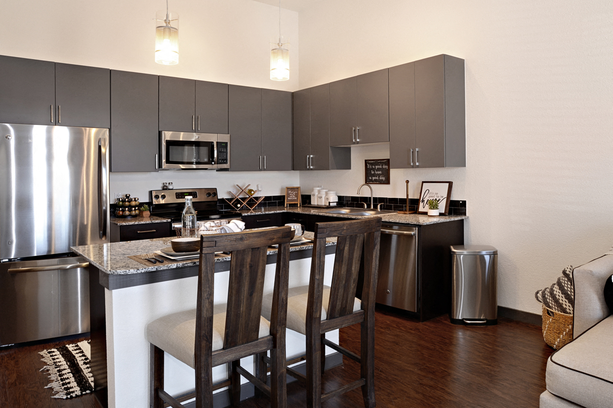 stainless steel. Every kitchen has a large island! at Epic Apartments, Denton, Texas