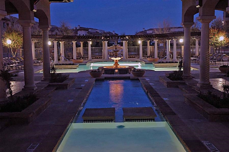 a pool is lit up at night