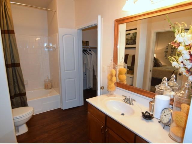 a bathroom with a toilet and a sink and a mirror