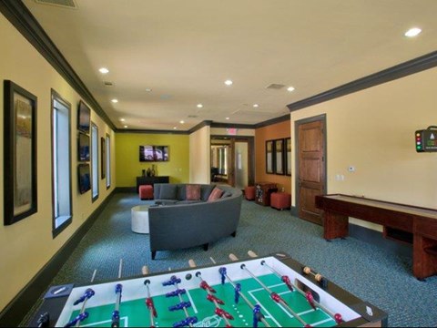 a living room with a pool table