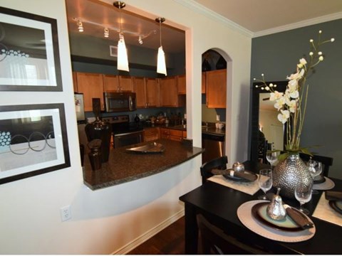 a kitchen with a dining room table and