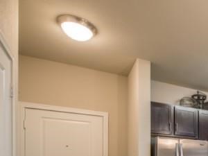 Luxurious kitchen, stainless steel appliances, stunning large islands and faux wood flooring.