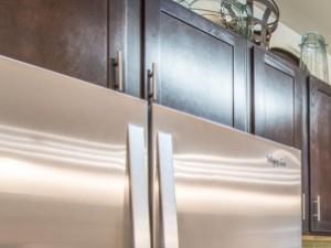 Luxurious kitchen, stainless steel appliances, stunning large islands and faux wood flooring.