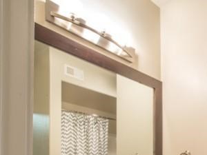 Spacious bathroom, with framed mirror.