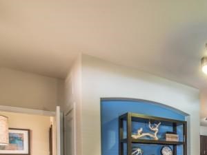 Spacious living room with faux hardwood floors, beautiful natural light and open floor plan.