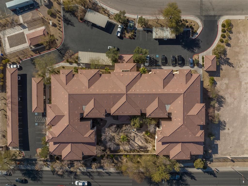 an aerial view of a house with a brown roof