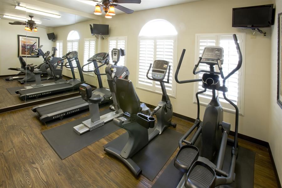 a group of exercise equipment in a gym