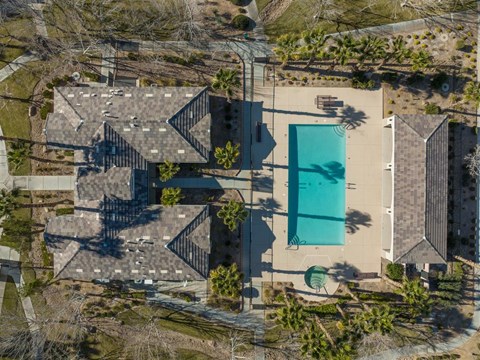 a birds eye view of a house with a blue pool