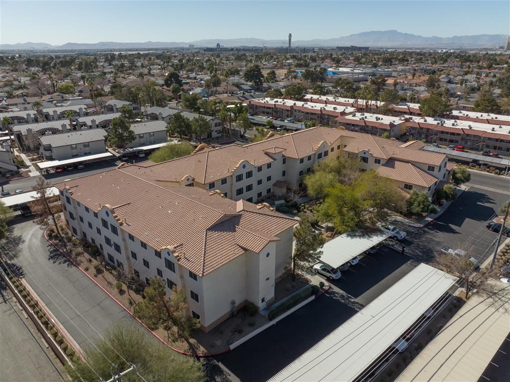 an aerial view of a building with a tile roof