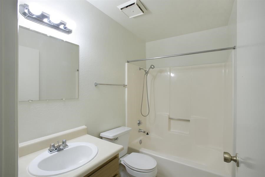 a bathroom with a sink toilet and a shower