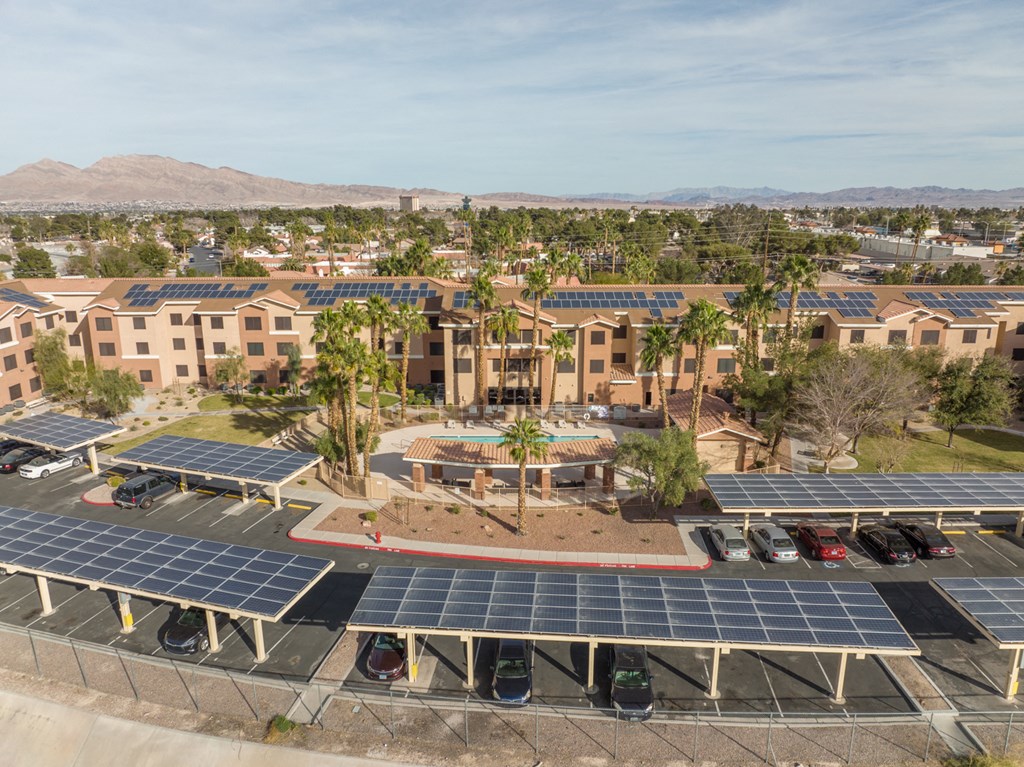 an aerial view of a parking lot with solar panels