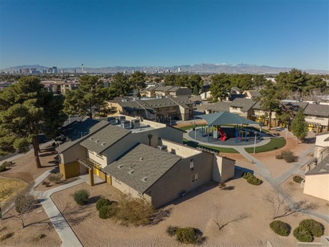 a aerial view of a neighborhood with houses and a playground