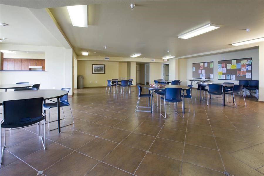 a dining room with tables and chairs