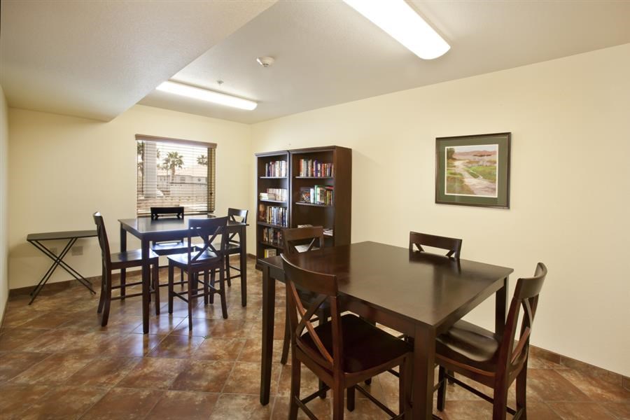 a dining room with a table and chairs
