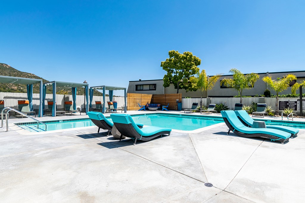 Outdoor pool area with lounge chairs