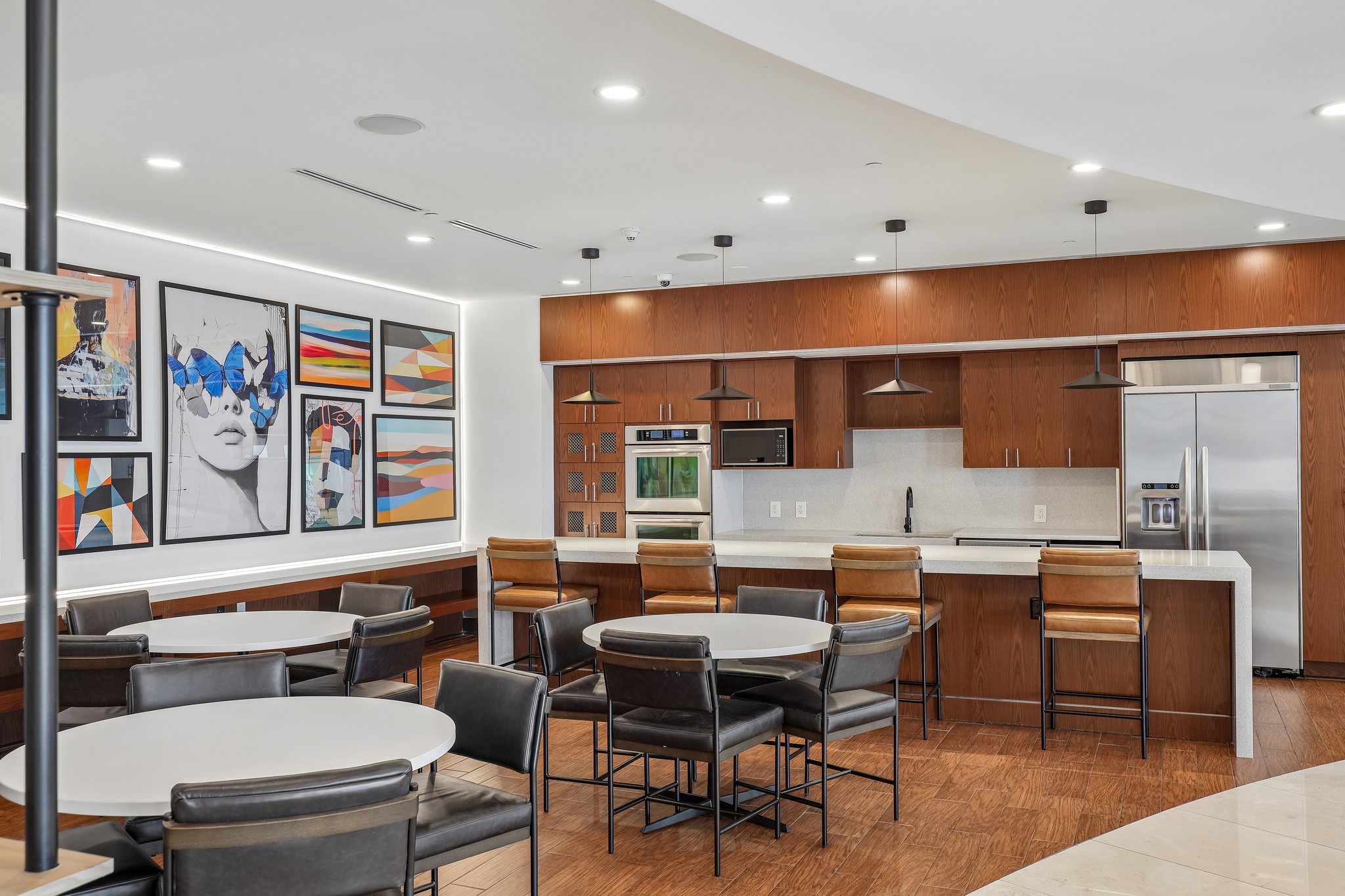 A modern kitchen and dining area with a curved table and chairs.