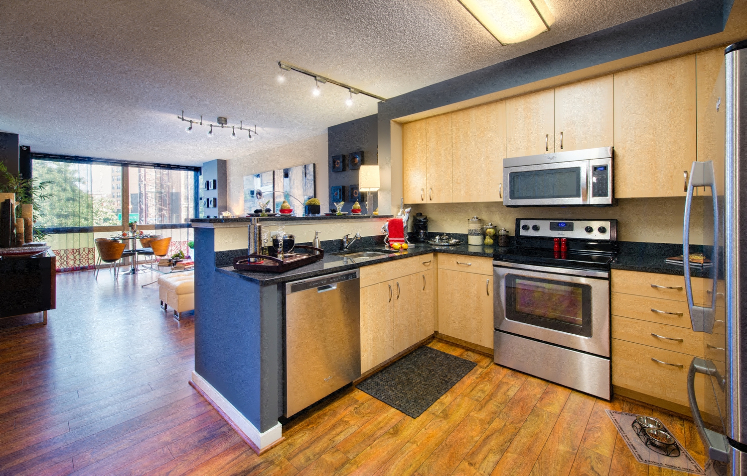 a kitchen with an island and a stove and a microwave