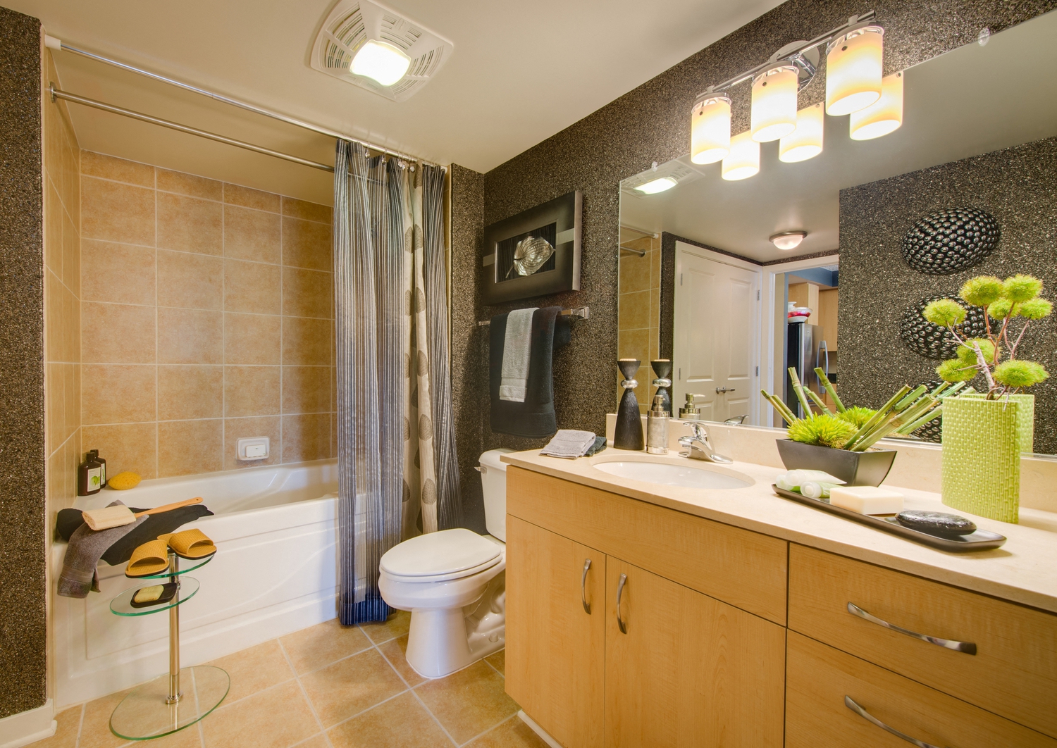 a bathroom with a sink and a toilet and a shower