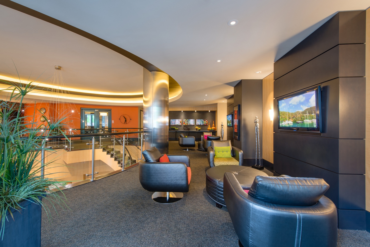 the lobby of a hotel with couches and chairs