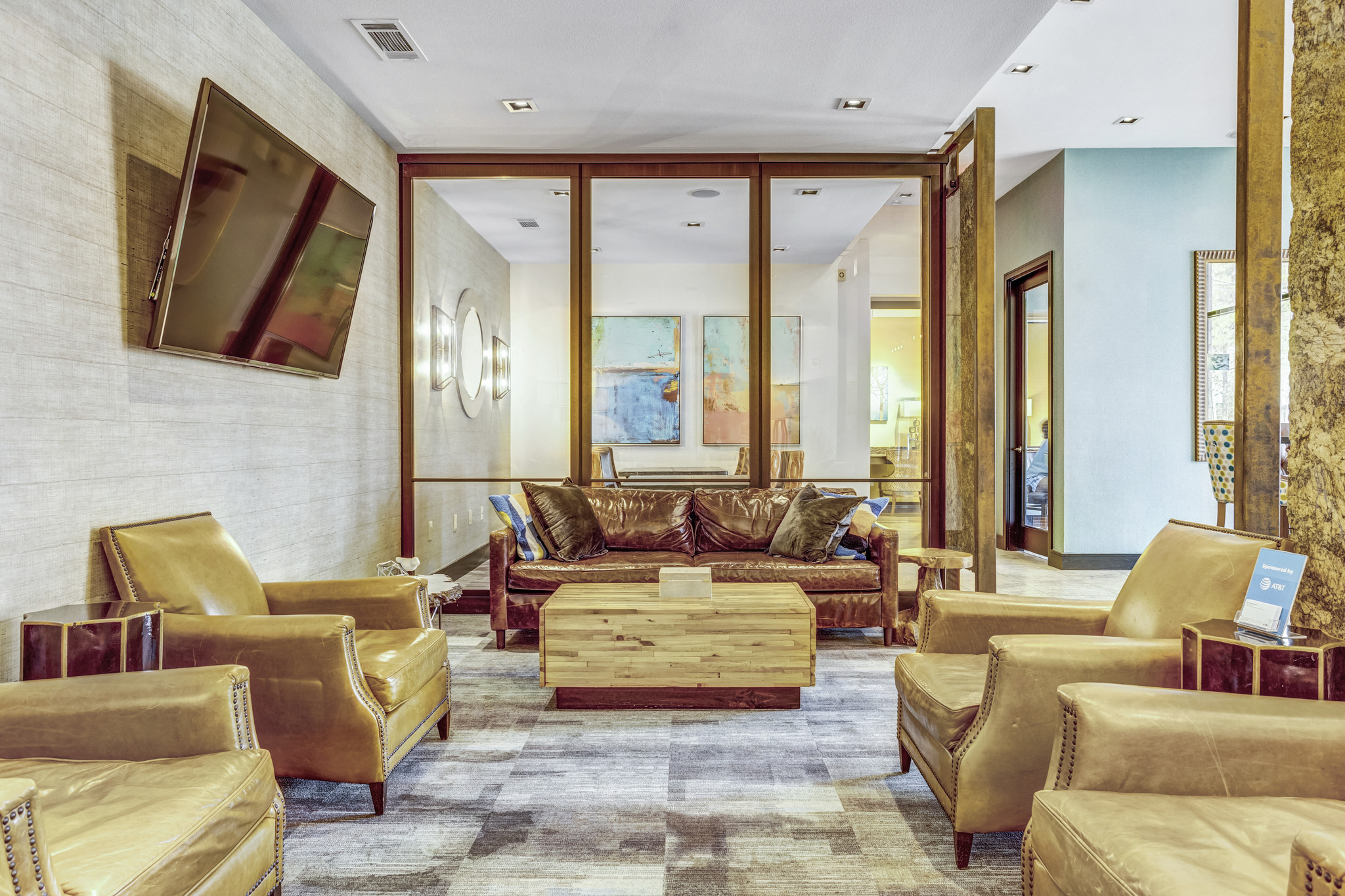a living room with couches and chairs and a coffee table
